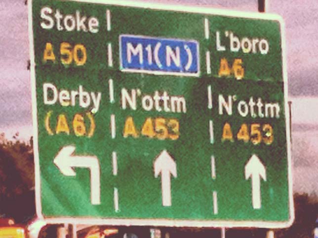 An A-road sign with directions marked. Nottingham is abbreviated as N’ottm