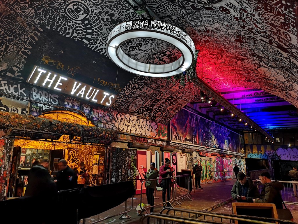 The graffiti covered walls and ceiling in the arch covered road outside The Vaults venue. 