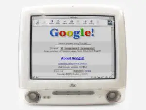 An old Apple Mac G3 displays the original Google search screen at Stanford University.