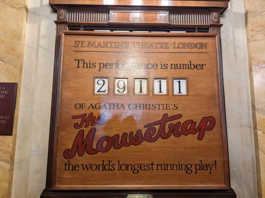 A wooden board tells us that this is performance 29111 of The Mousetrap