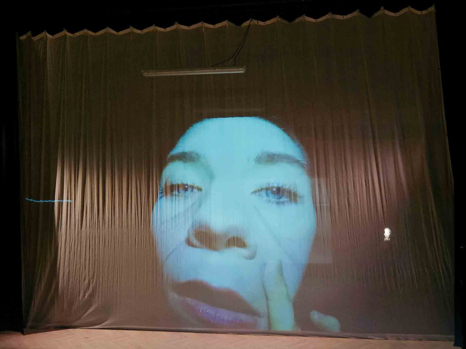The looming face of actor Venetia Bowe as Joy/Lear before Lost Lear's performance