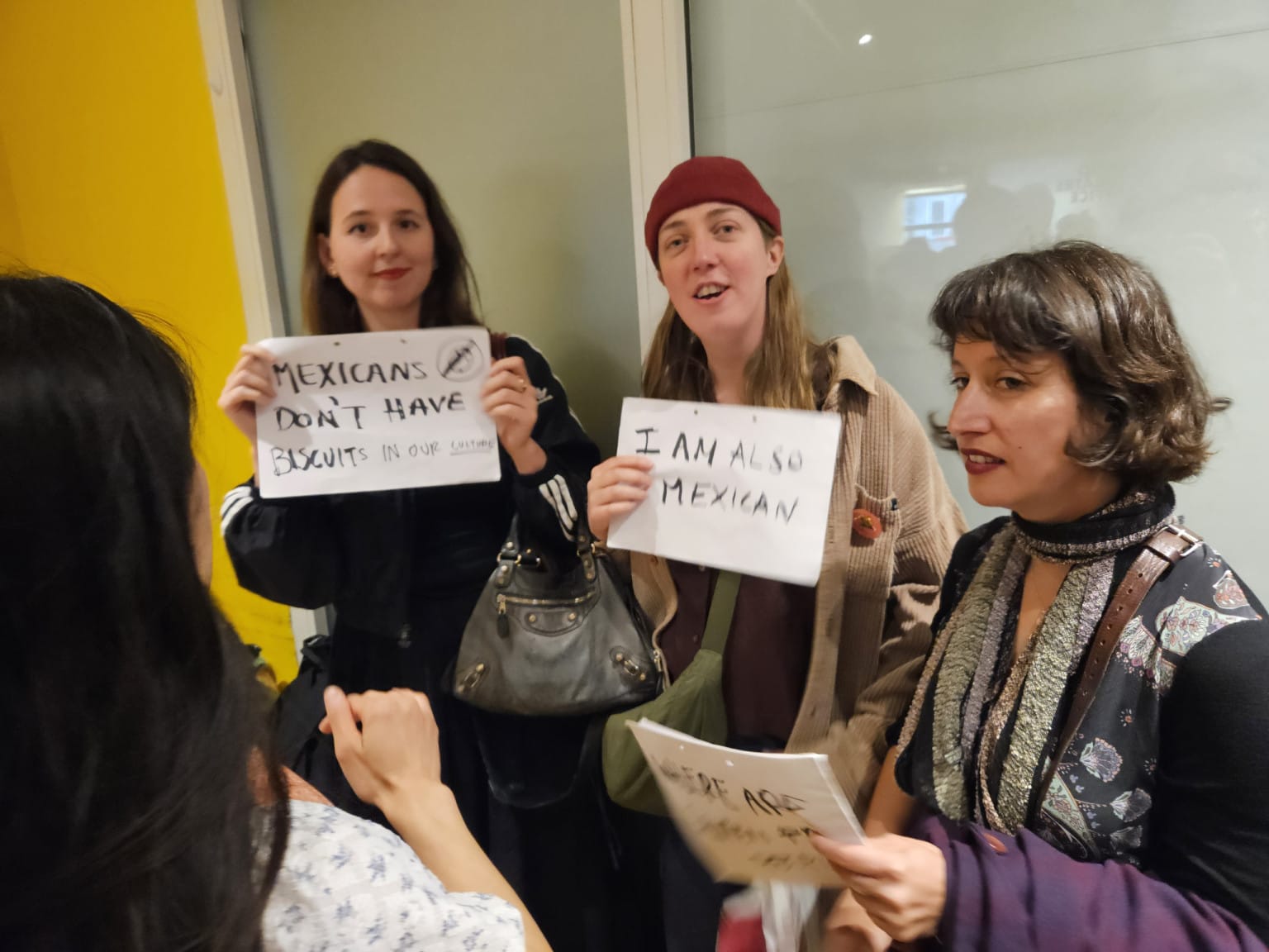 Audience members protesting the sale of participant produced crafts 