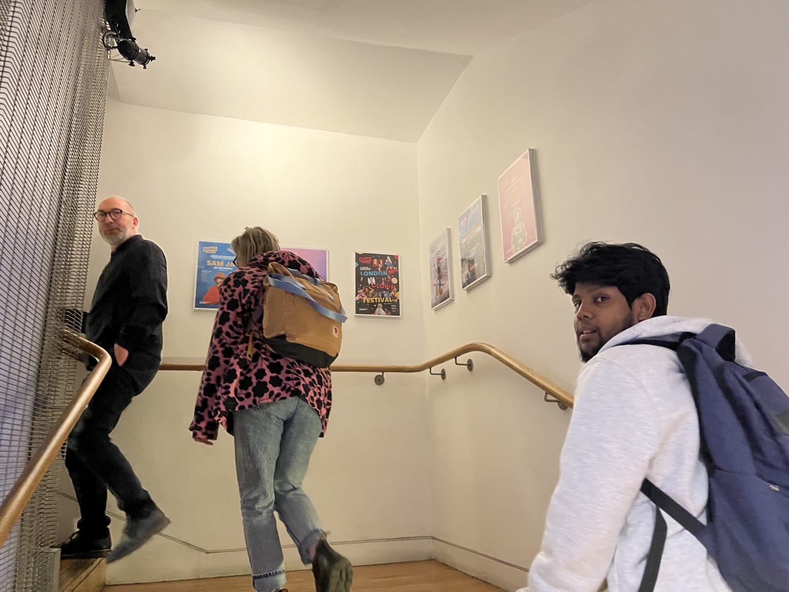The team climbing up the stairs to Soho's more intimate space 